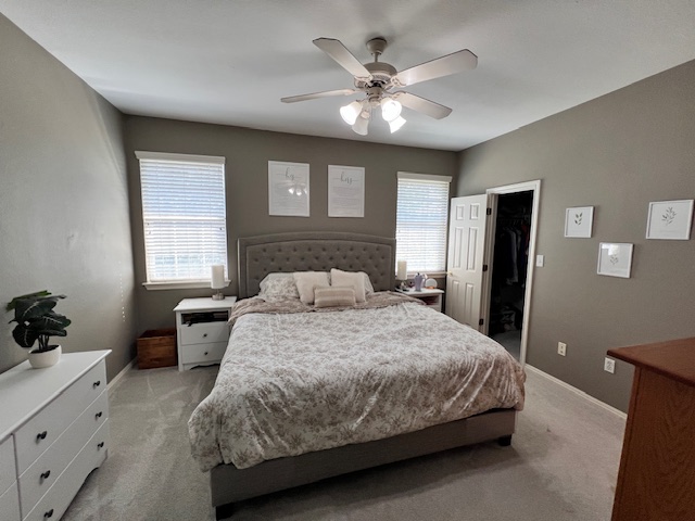 1101 East Parmer Lane, Unit 306 Austin, TX 78753 - Photo 18 of 30 a bedroom with a large bed and a chandelier