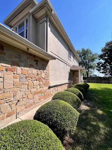 a house view with a backyard space