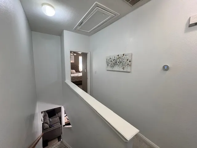 a view of a hallway with an empty room