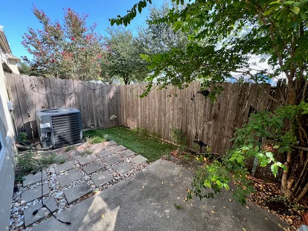 a backyard of a house with lots of green space