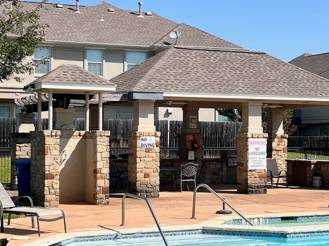 a front view of a house with glass windows and door