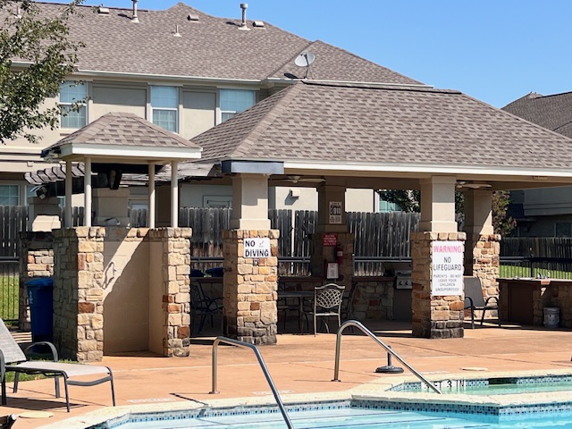 1101 East Parmer Lane, Unit 306 Austin, TX 78753 - Photo 30 of 30 a front view of a house with glass windows and door