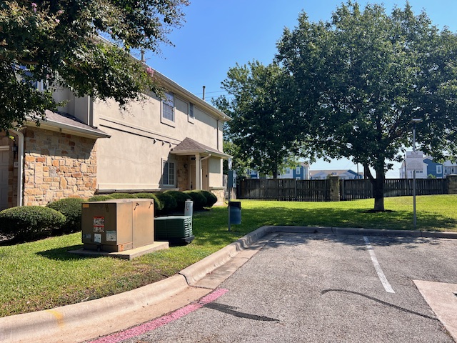 1101 East Parmer Lane, Unit 306 Austin, TX 78753 - Photo 3 of 30 a front view of house with yard and green space