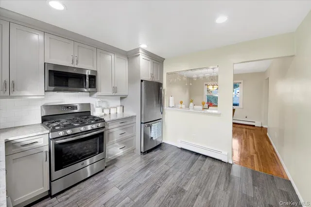 a kitchen with a stove a microwave and a refrigerator