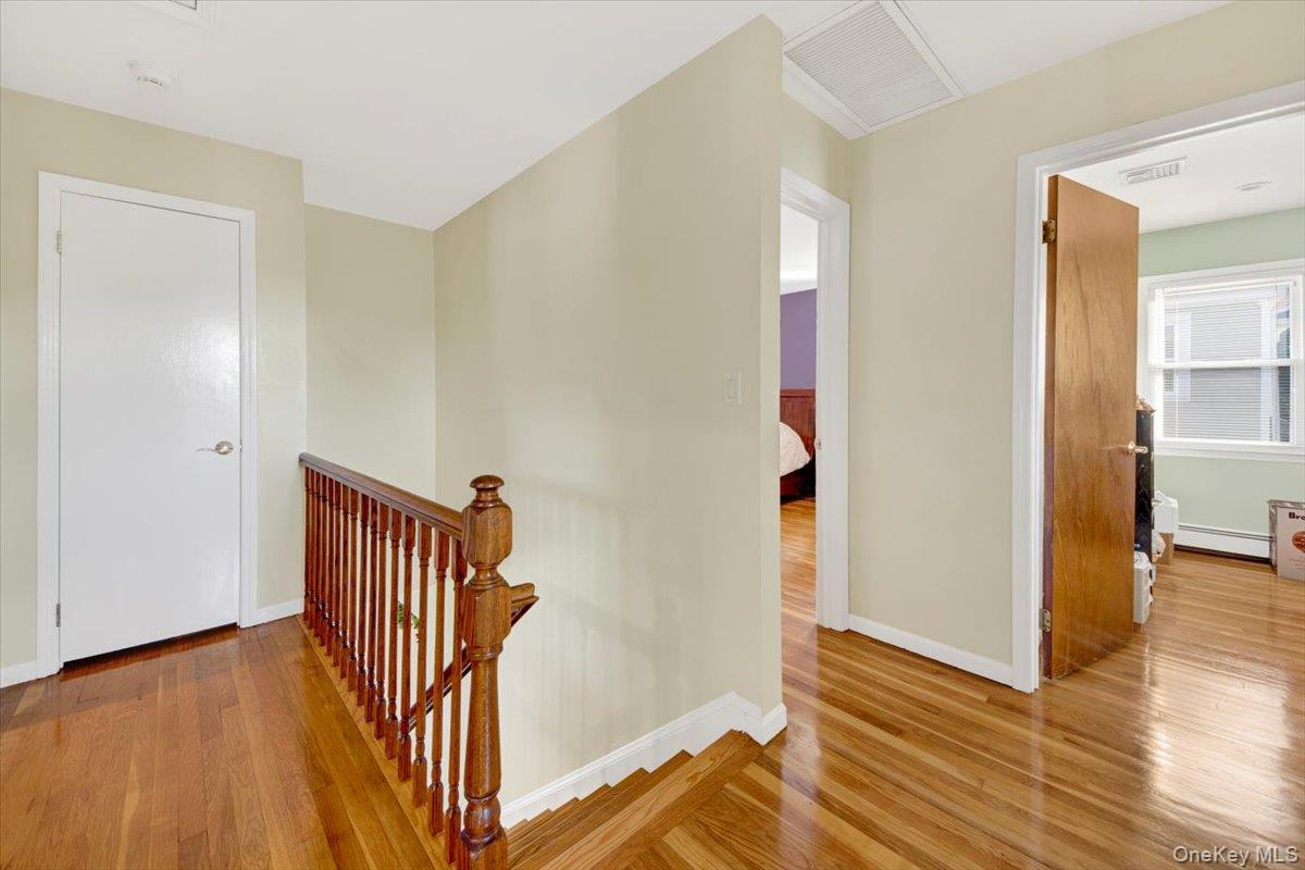 39 Deshon Avenue Bronxville, NY 10708 - Photo 13 of 30 a view of a hallway with wooden floor and stairs