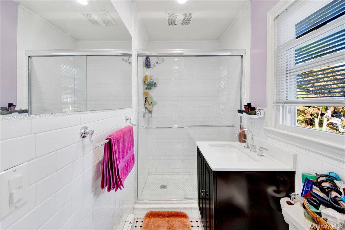 39 Deshon Avenue Bronxville, NY 10708 - Photo 15 of 30 a bathroom with a sink and a mirror