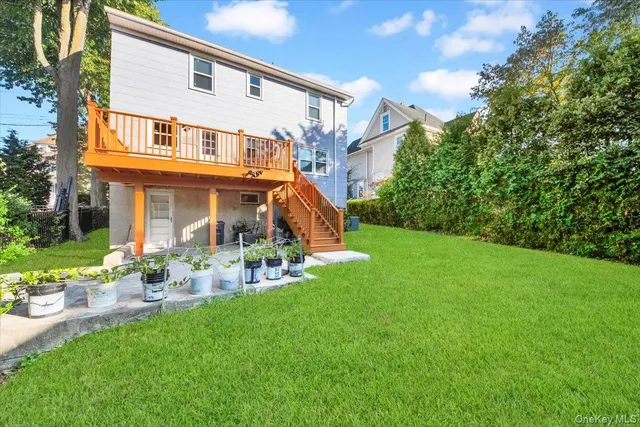 a view of a house with a yard porch and sitting area