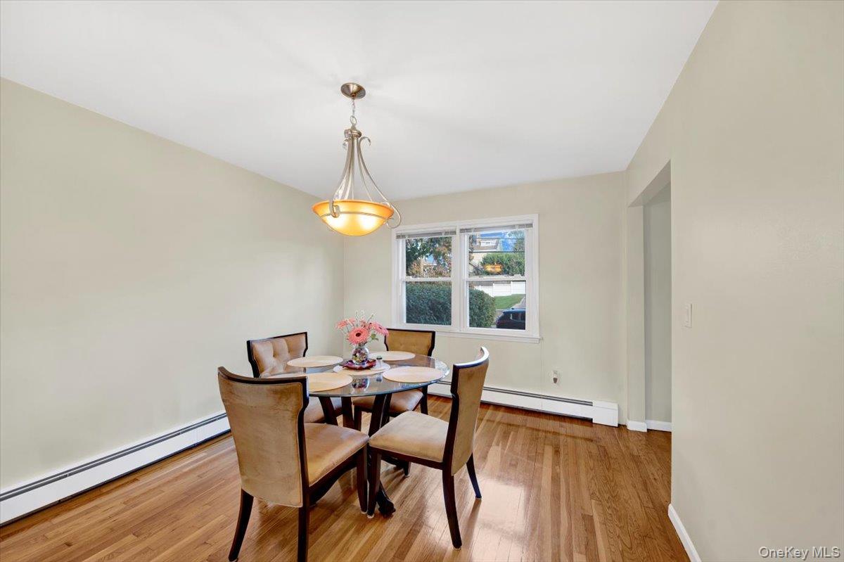 39 Deshon Avenue Bronxville, NY 10708 - Photo 8 of 30 a view of a dining room with furniture and wooden floor