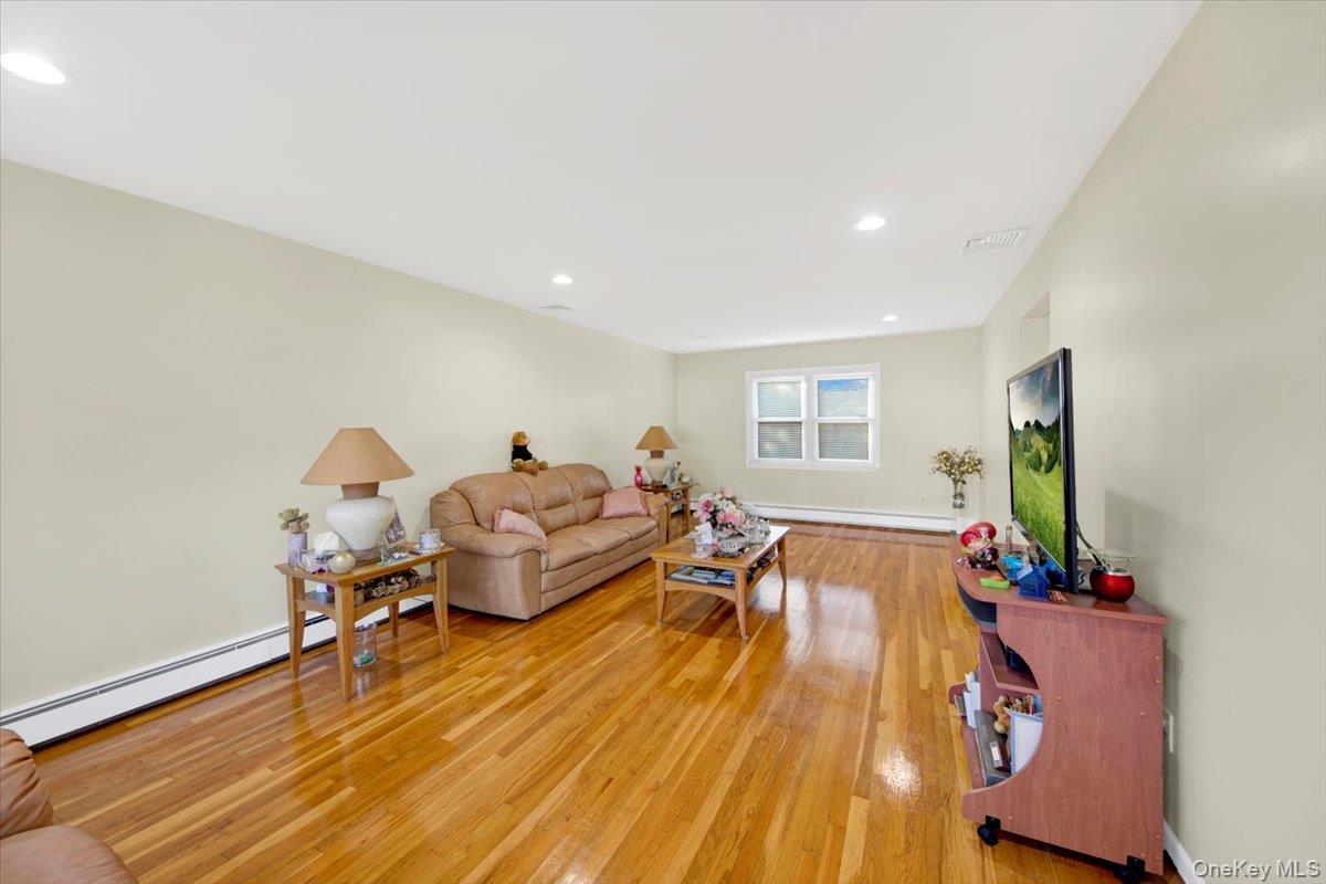 39 Deshon Avenue Bronxville, NY 10708 - Photo 9 of 30 a living room with furniture and a flat screen tv