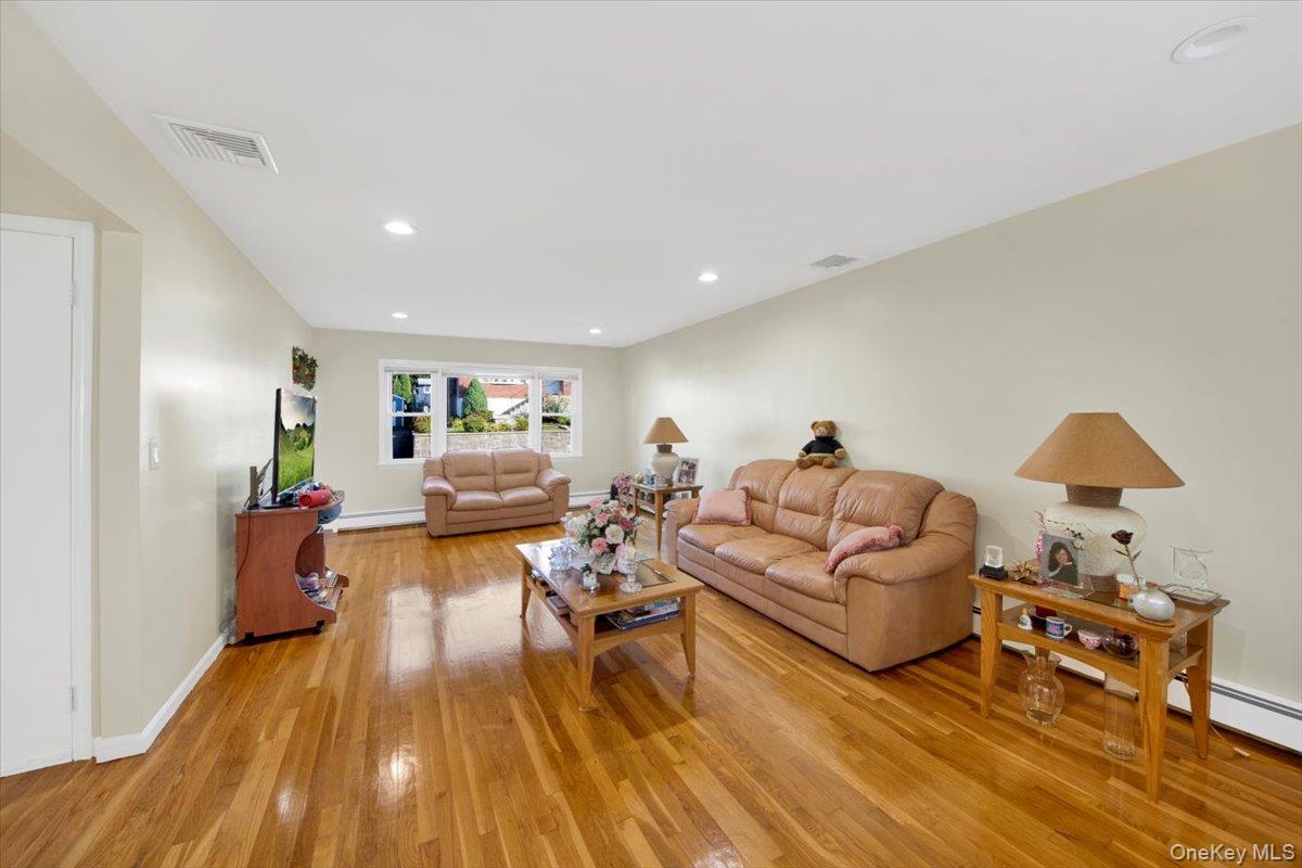 39 Deshon Avenue Bronxville, NY 10708 - Photo 10 of 30 a living room with furniture and a wooden floor