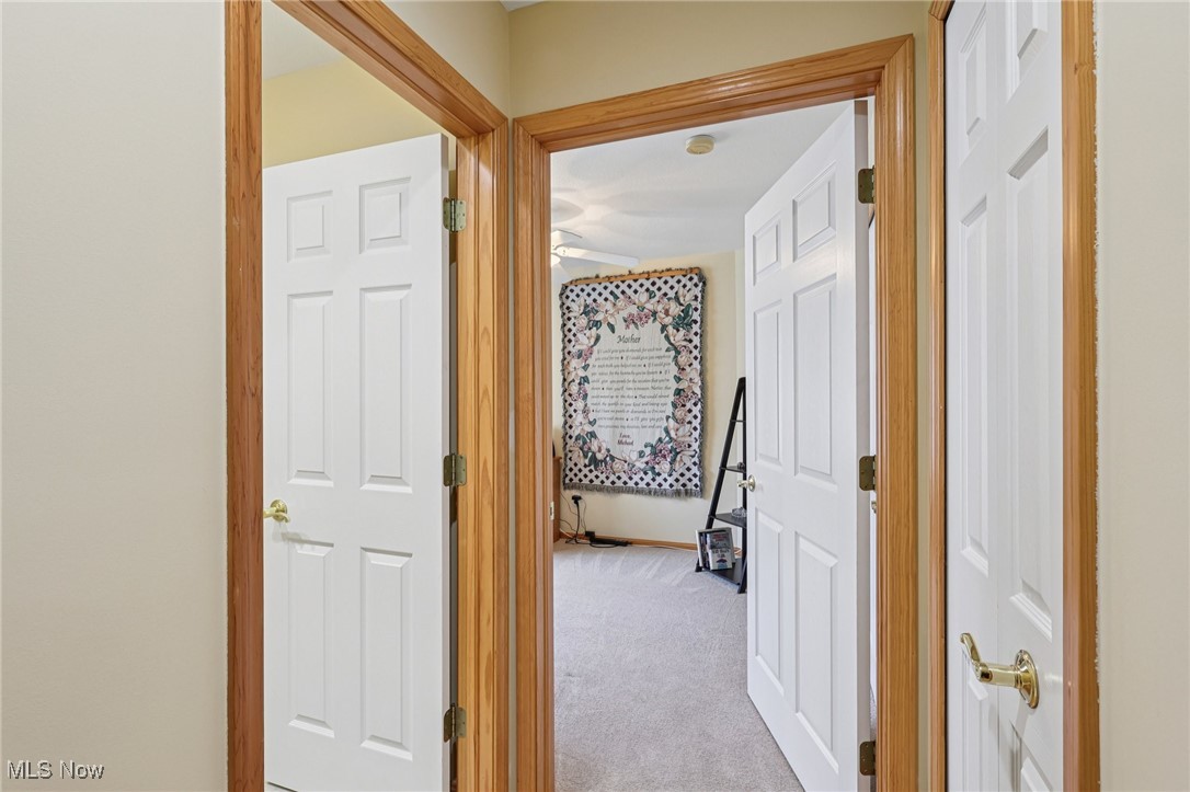 6894 Paradise Way North Ridgeville, OH 44039 - Photo 30 of 36 View to 1/2 bath, guest bedroom, linen closet.
