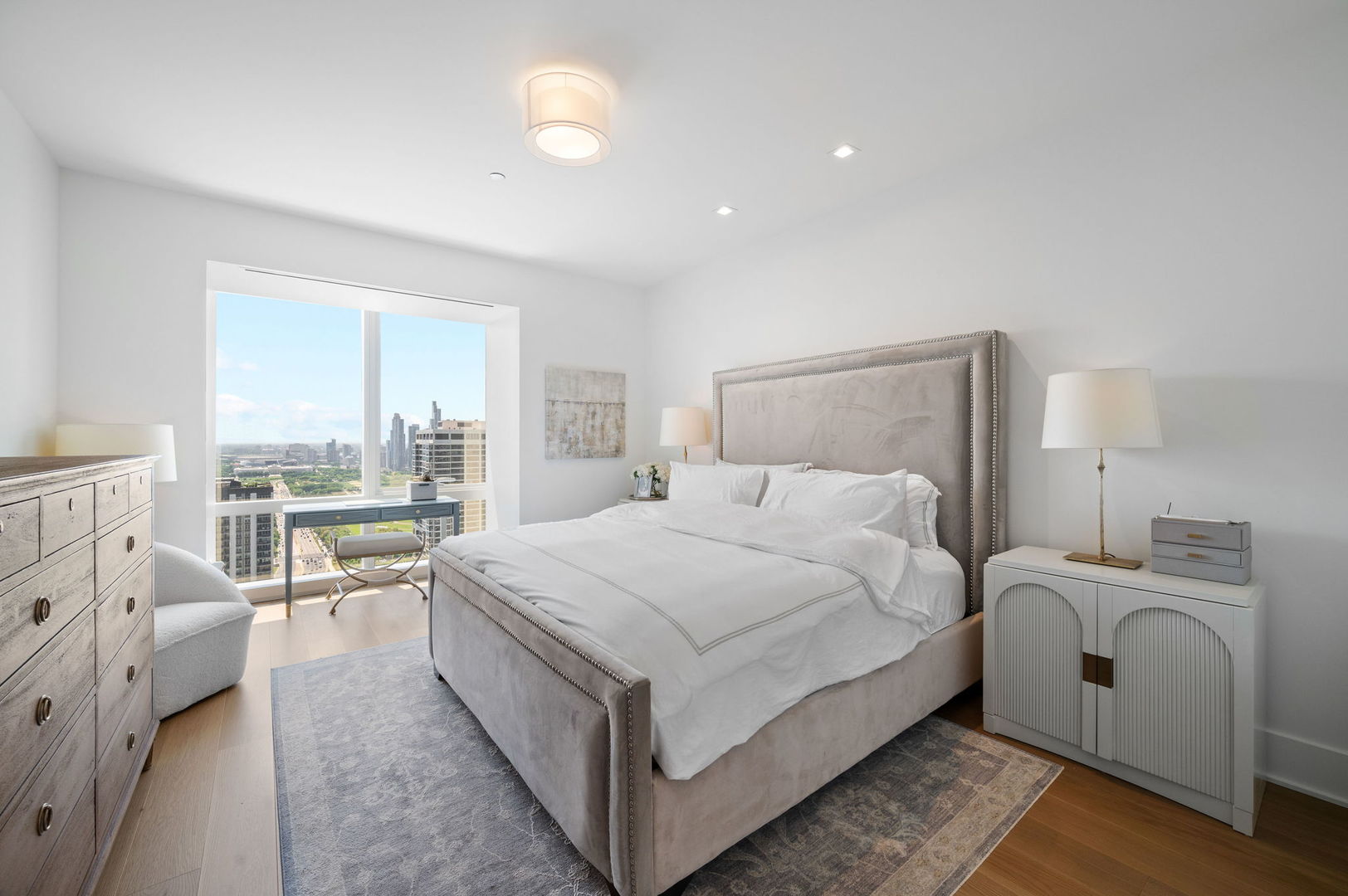 363 East Wacker Drive, Unit 3109 Chicago, IL 60601 - Photo 14 of 24 a bedroom with a bed and a large window