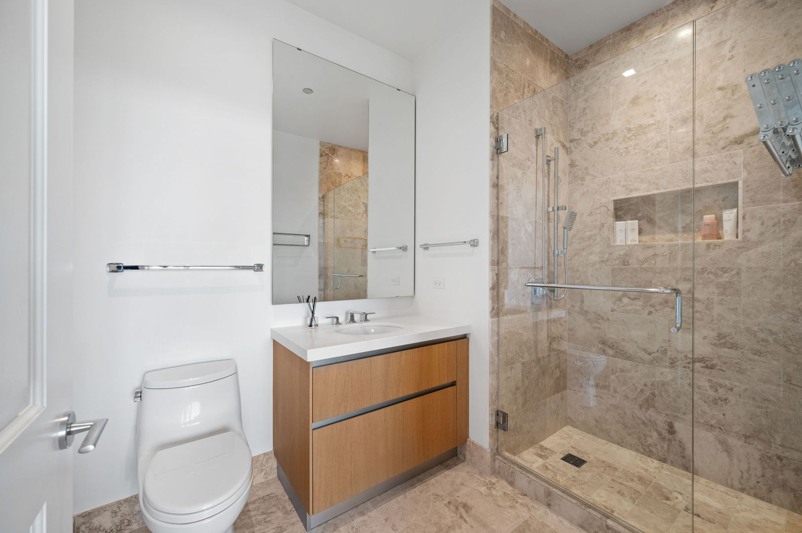 363 East Wacker Drive, Unit 3109 Chicago, IL 60601 - Photo 20 of 24 a bathroom with a toilet a sink and shower