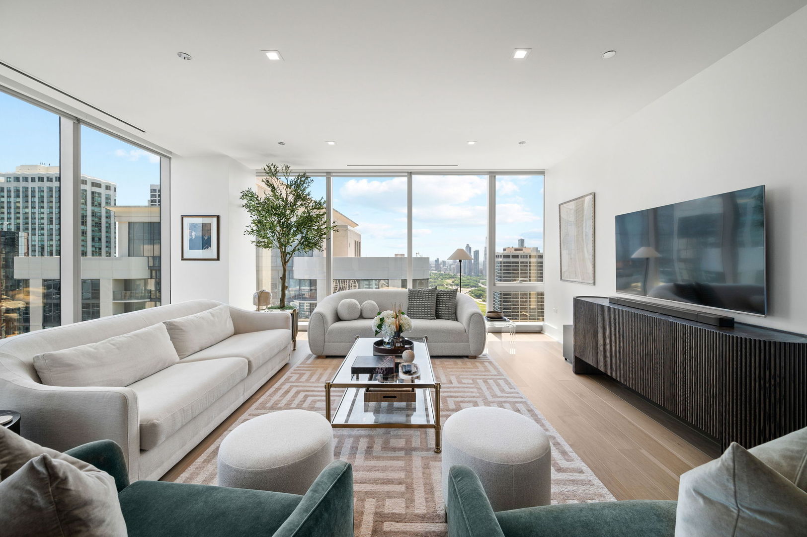 363 East Wacker Drive, Unit 3109 Chicago, IL 60601 - Photo 6 of 24 a living room with furniture large windows and a flat screen tv