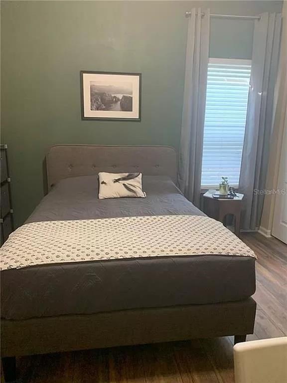 9883 Northwest 17th Road Gainesville, FL 32606 - Photo 10 of 11 a bedroom with a bed and a window