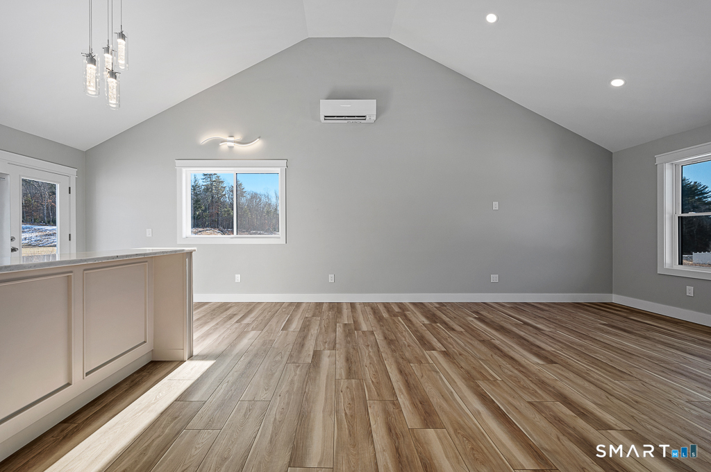 121 New Road Thompson, CT 06277 - Photo 11 of 40 wooden floor in an empty room with a window