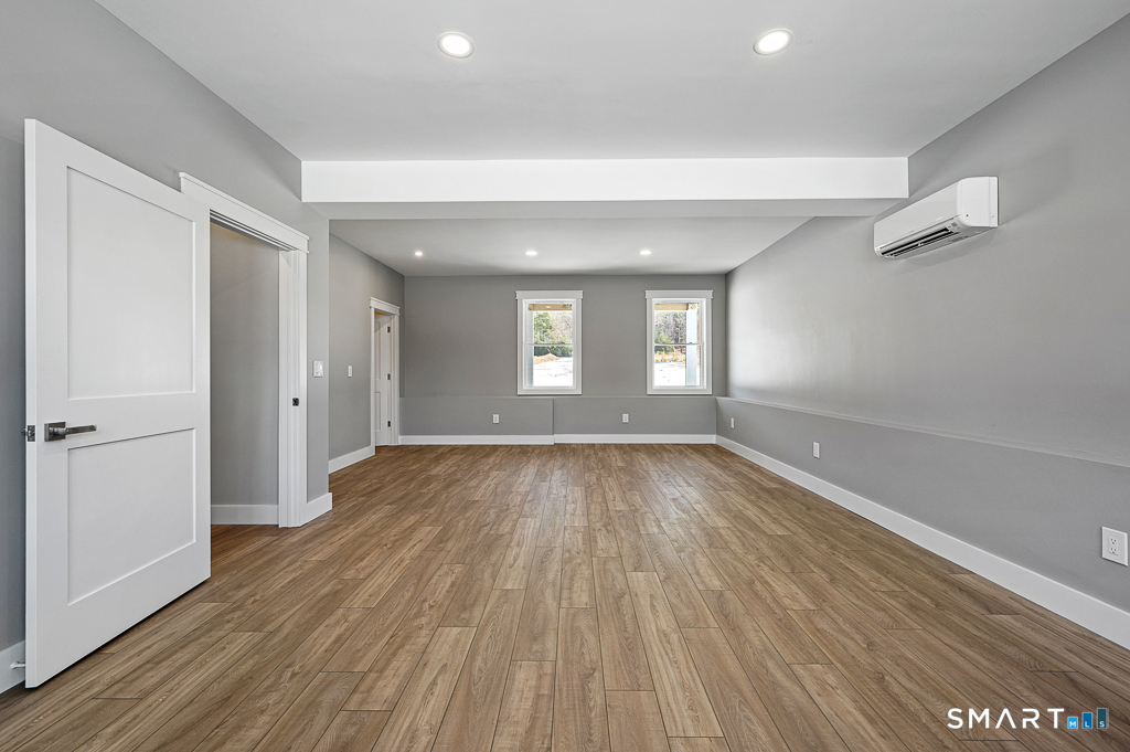 121 New Road Thompson, CT 06277 - Photo 16 of 40 wooden floor in an empty room with a window