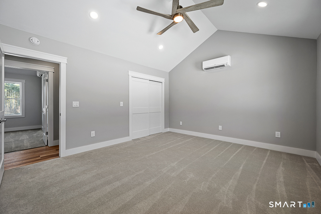 121 New Road Thompson, CT 06277 - Photo 19 of 40 an empty room with ceiling fan and window