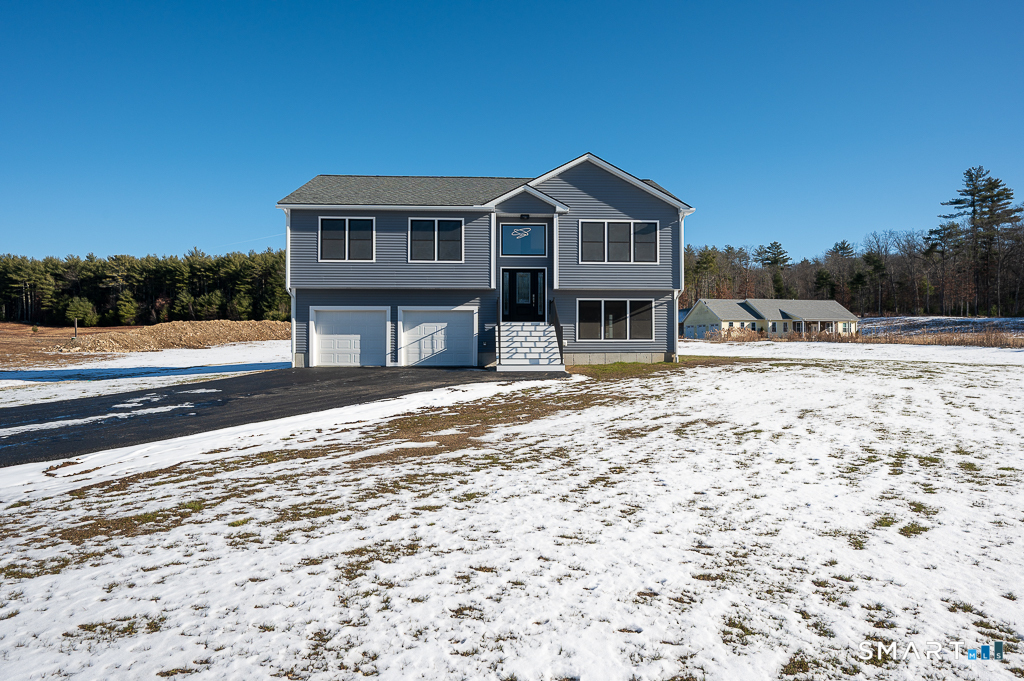 121 New Road Thompson, CT 06277 - Photo 2 of 40 a view of a house with a yard
