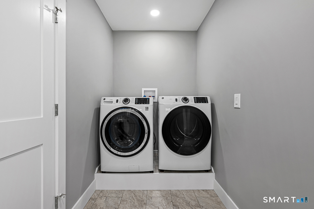 121 New Road Thompson, CT 06277 - Photo 26 of 40 a utility room with dryer and washer