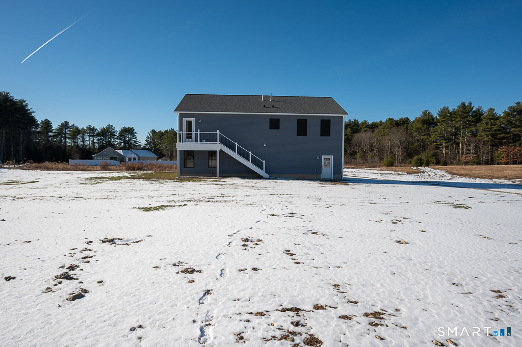 121 New Road Thompson, CT 06277 - Photo 39 of 40 a house with a wooden fence