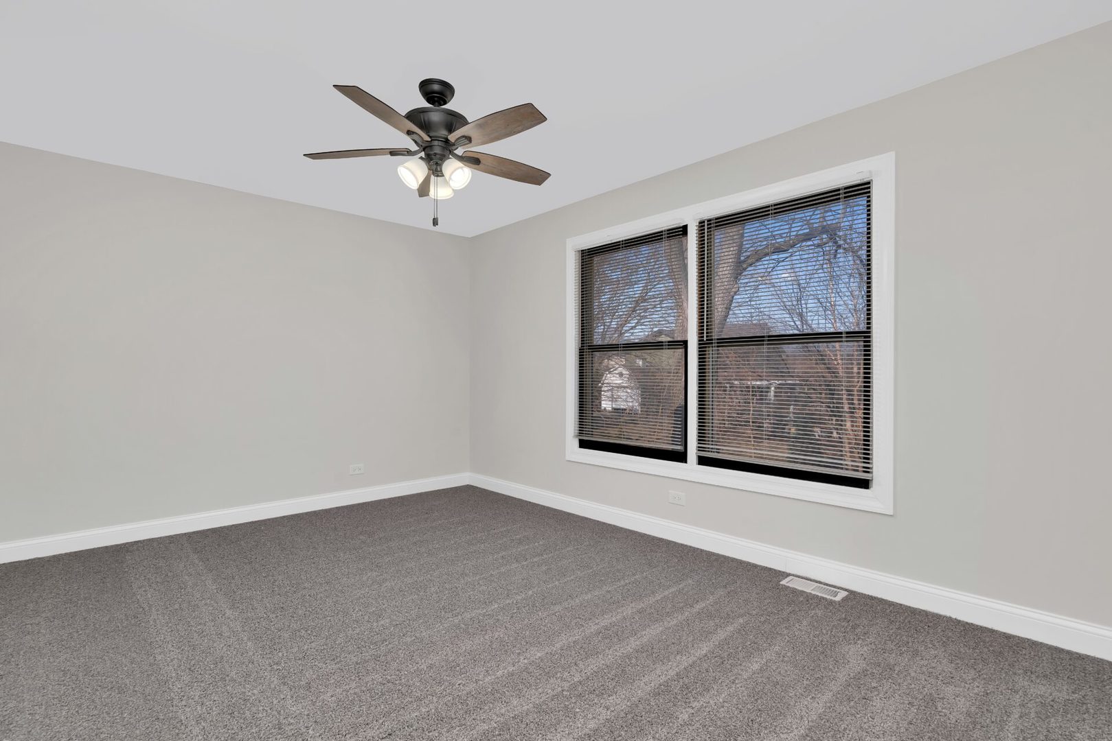5332 Crescent Lane, Unit D Oak Forest, IL 60452 - Photo 12 of 17 an empty room with windows and ceiling fan