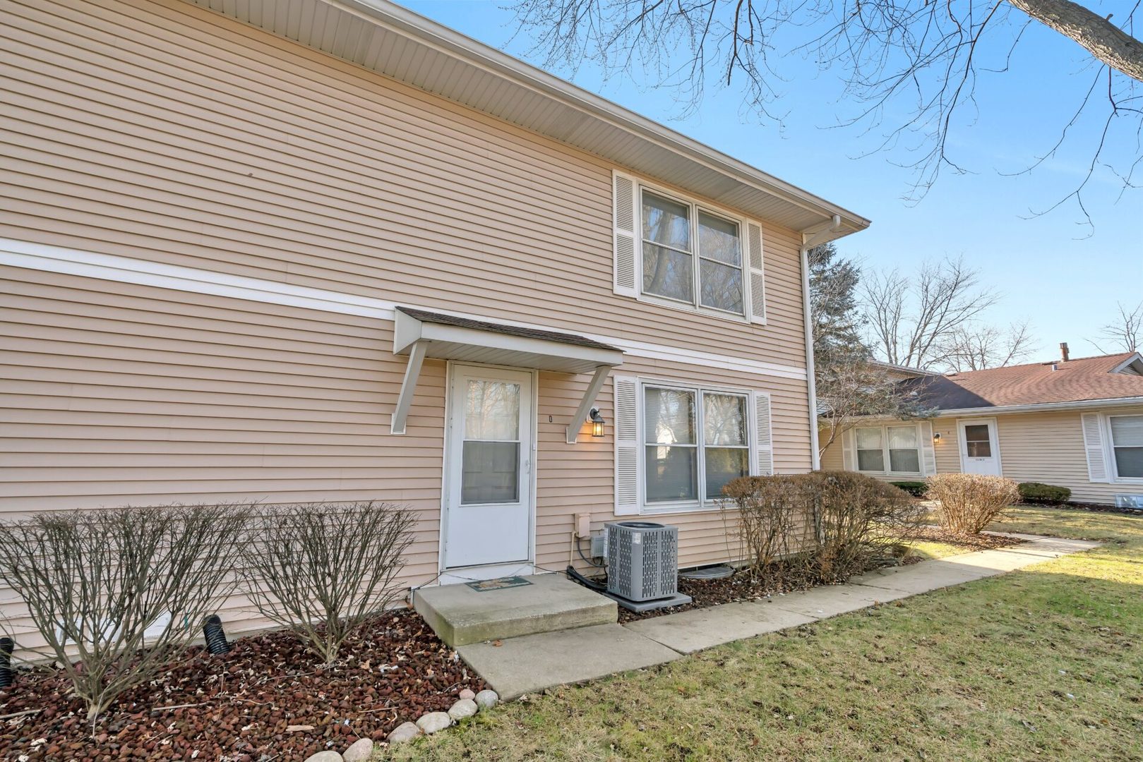 5332 Crescent Lane, Unit D Oak Forest, IL 60452 - Photo 2 of 17 a front view of a house with garden