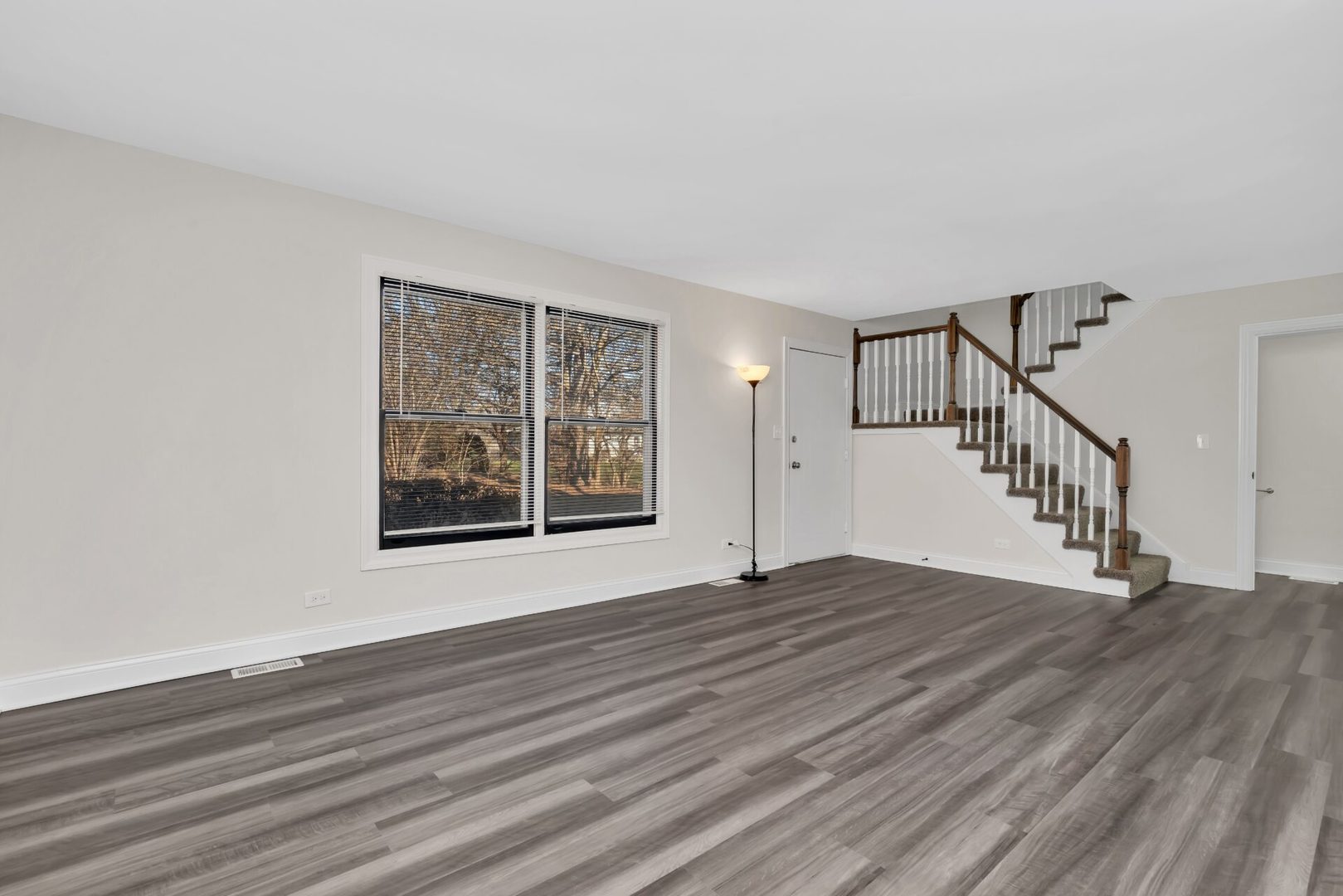 5332 Crescent Lane, Unit D Oak Forest, IL 60452 - Photo 3 of 17 a view of an empty room with wooden floor and a window
