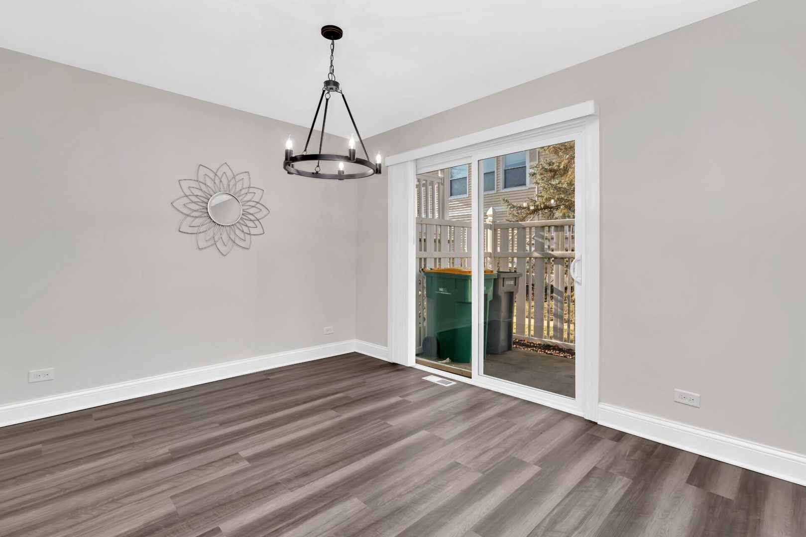 5332 Crescent Lane, Unit D Oak Forest, IL 60452 - Photo 5 of 17 a view of a room with wooden floor closet and chandelier