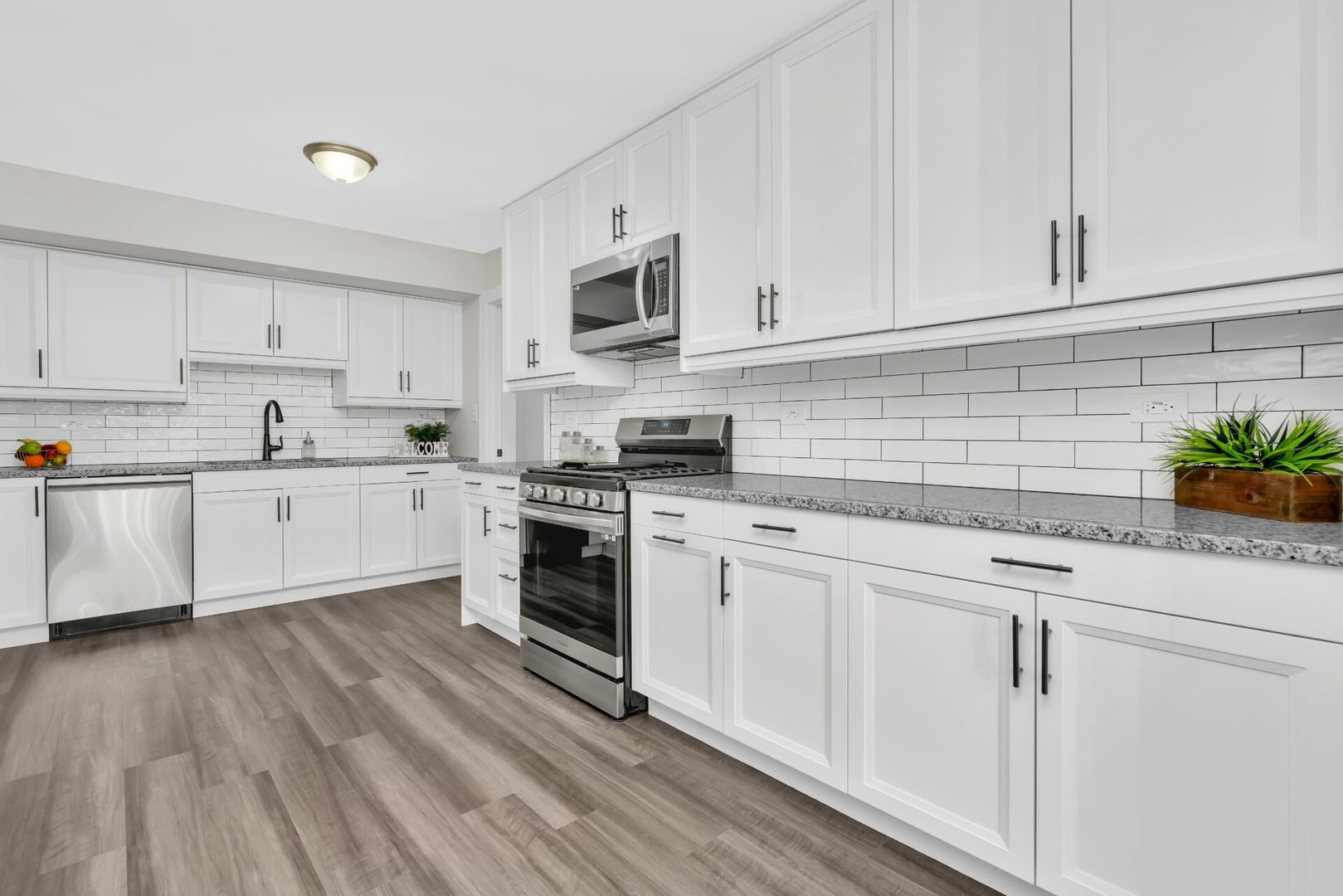 5332 Crescent Lane, Unit D Oak Forest, IL 60452 - Photo 7 of 17 a kitchen with granite countertop white cabinets and white appliances