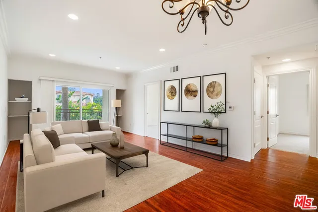 a living room with furniture with wooden floor