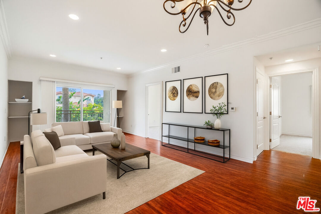 a living room with furniture with wooden floor
