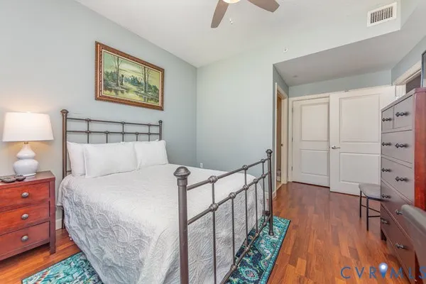 a bedroom with a bed and a table