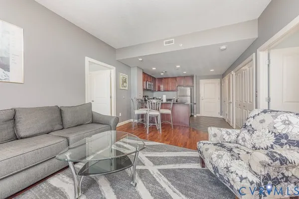a living room with furniture and a table