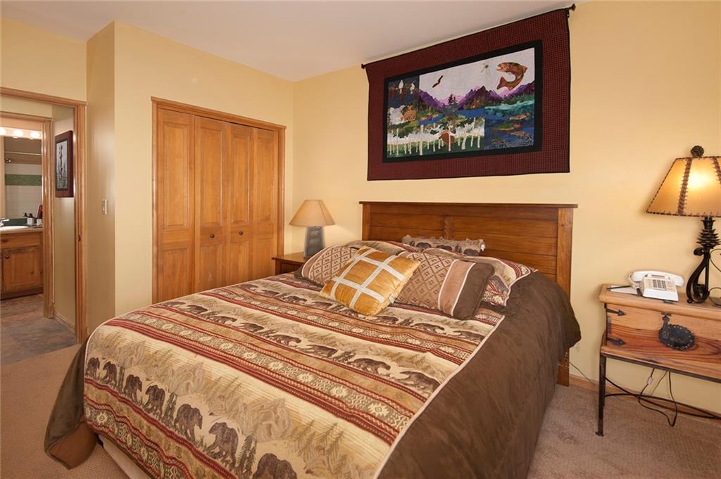 129 River Run Road, Unit 8063 Keystone, CO 80435 - Photo 5 of 23 a bedroom with a bed and cupboard