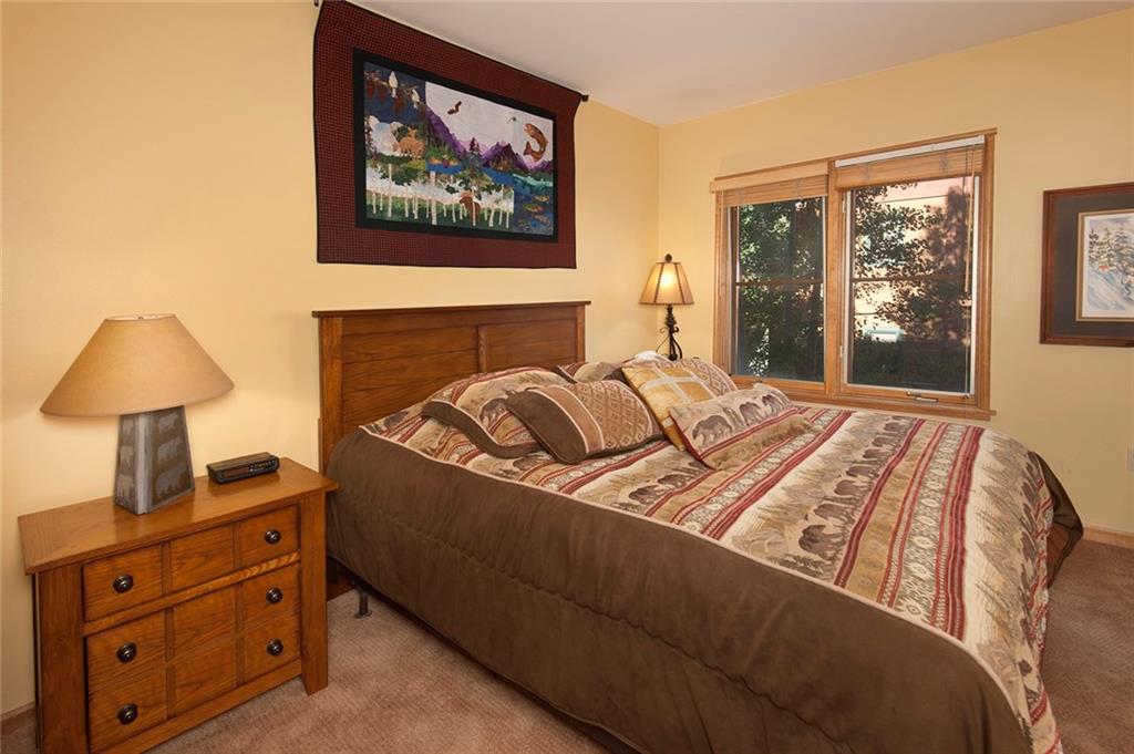 129 River Run Road, Unit 8063 Keystone, CO 80435 - Photo 9 of 23 a bedroom with a bed and a window