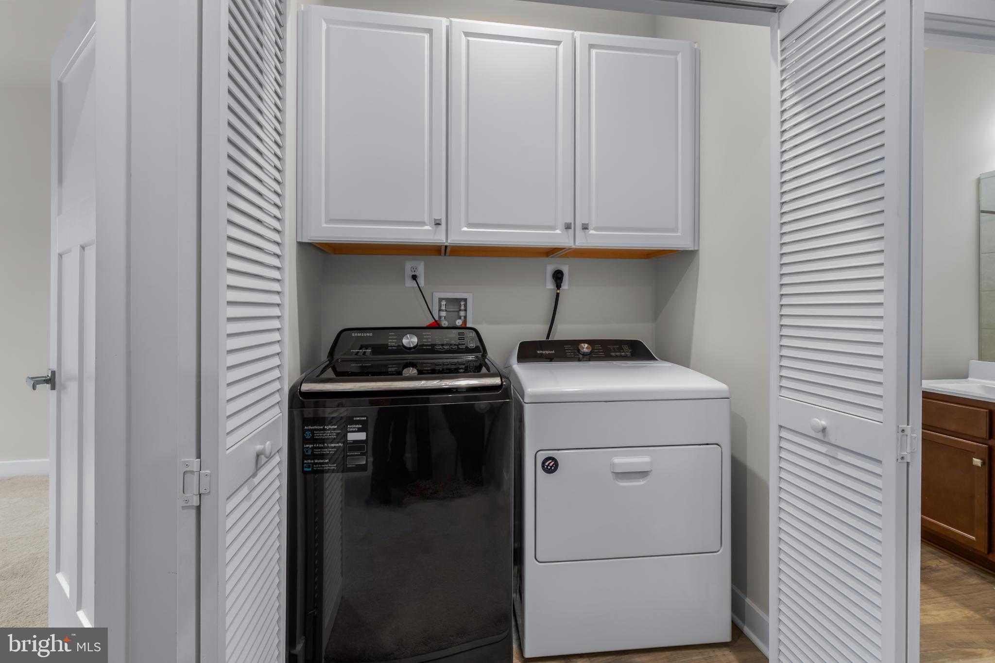 117 Hawlings River Road Laurel, MD 20708 - Photo 22 of 33 Efficient laundry space with stylish storage.