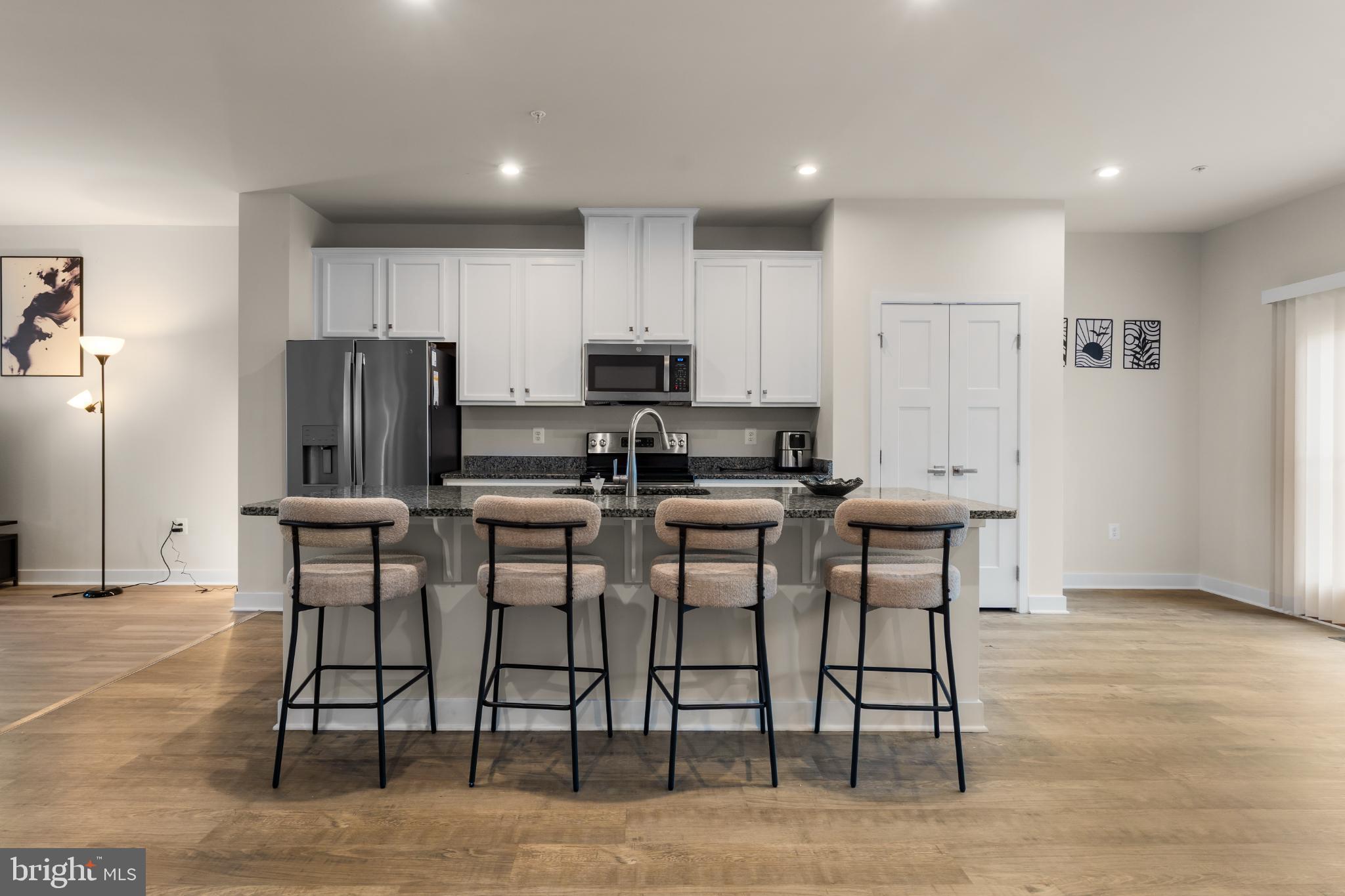 117 Hawlings River Road Laurel, MD 20708 - Photo 8 of 33 Modern kitchen with stylish bar seating.