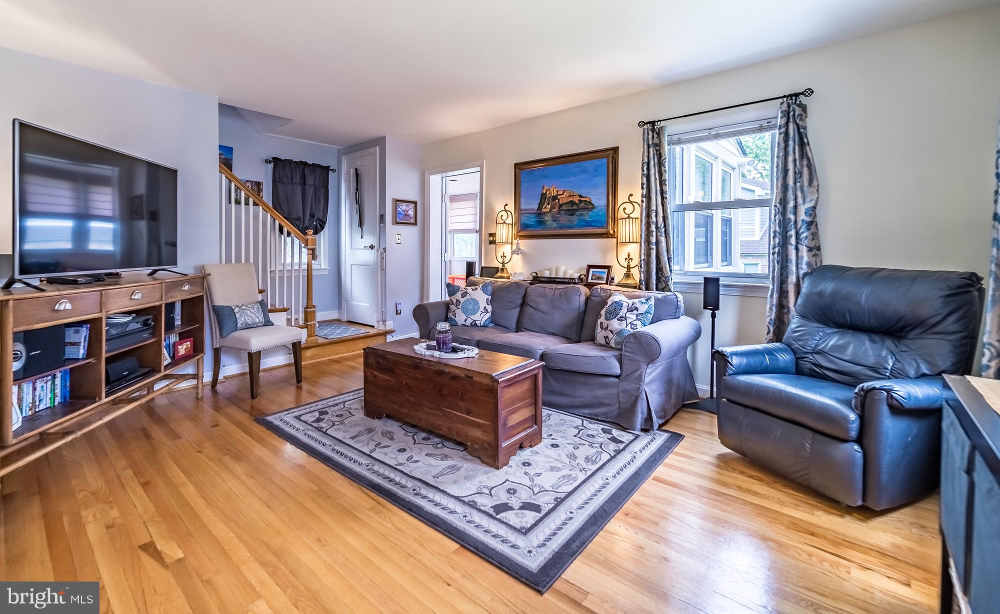 1603 Moffet Road Silver Spring, MD 20903 - Photo 15 of 30 a living room with furniture and a flat screen tv