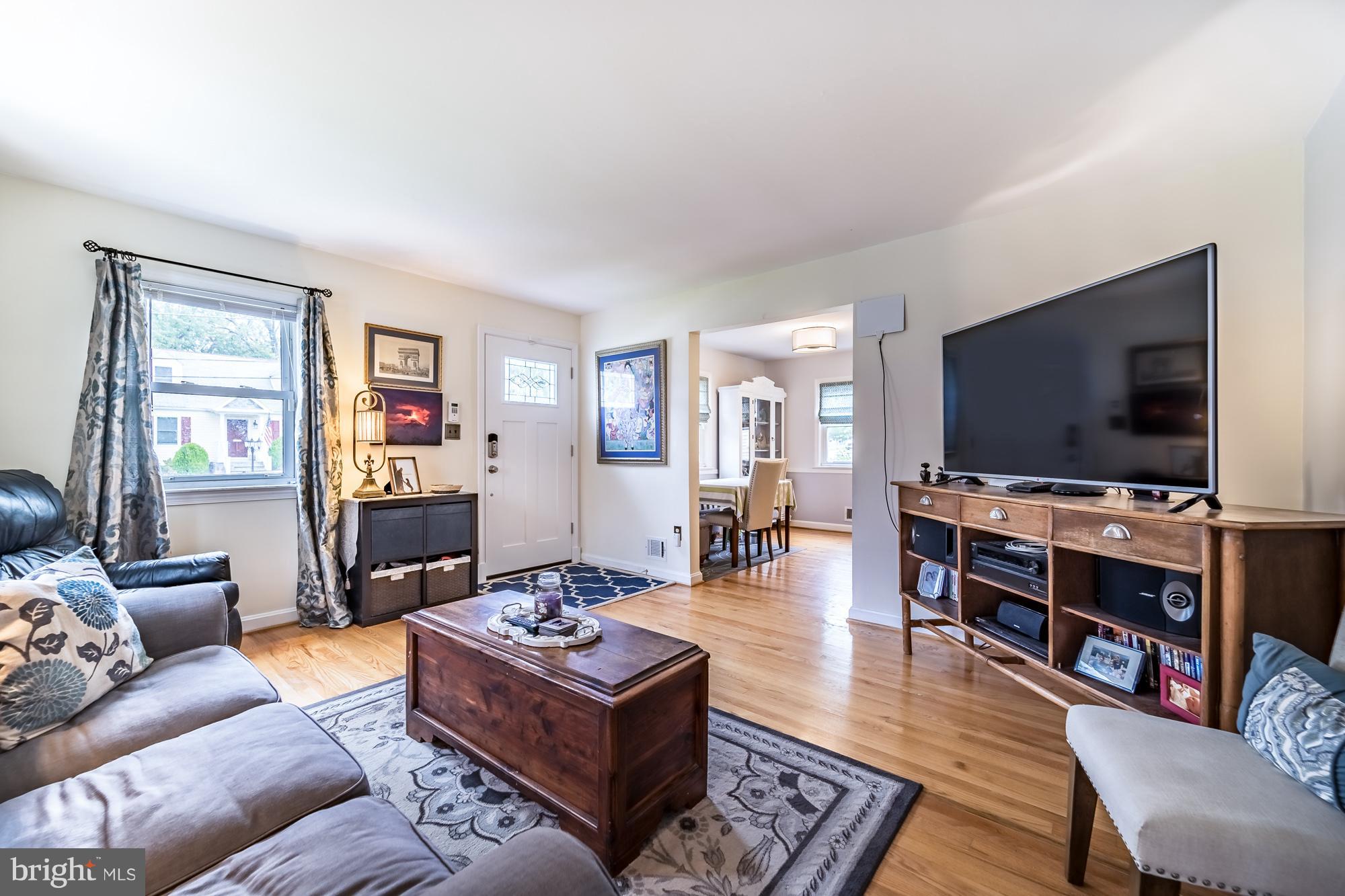 1603 Moffet Road Silver Spring, MD 20903 - Photo 17 of 30 a living room with furniture and a flat screen tv