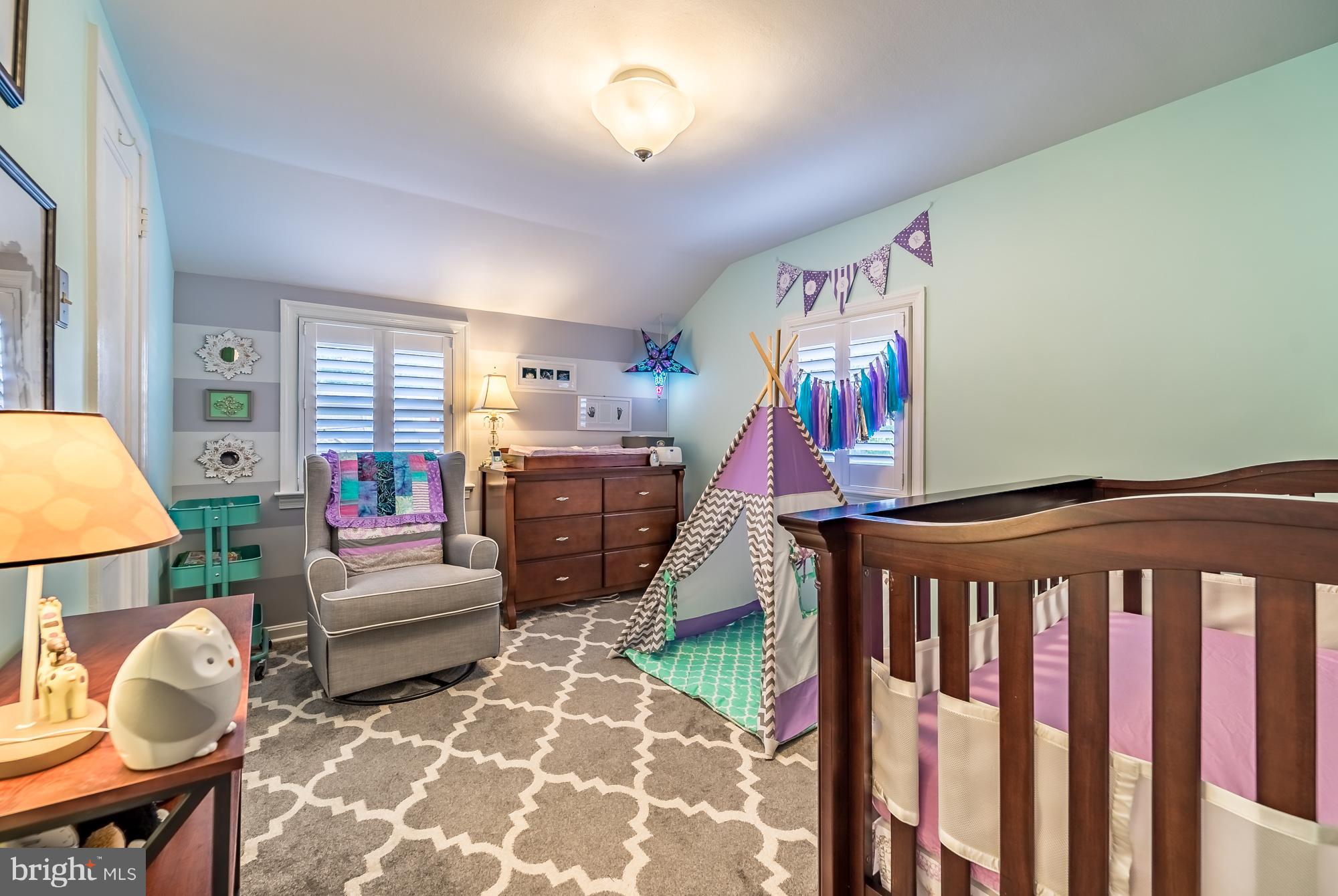 1603 Moffet Road Silver Spring, MD 20903 - Photo 21 of 30 a bedroom with furniture and a rug