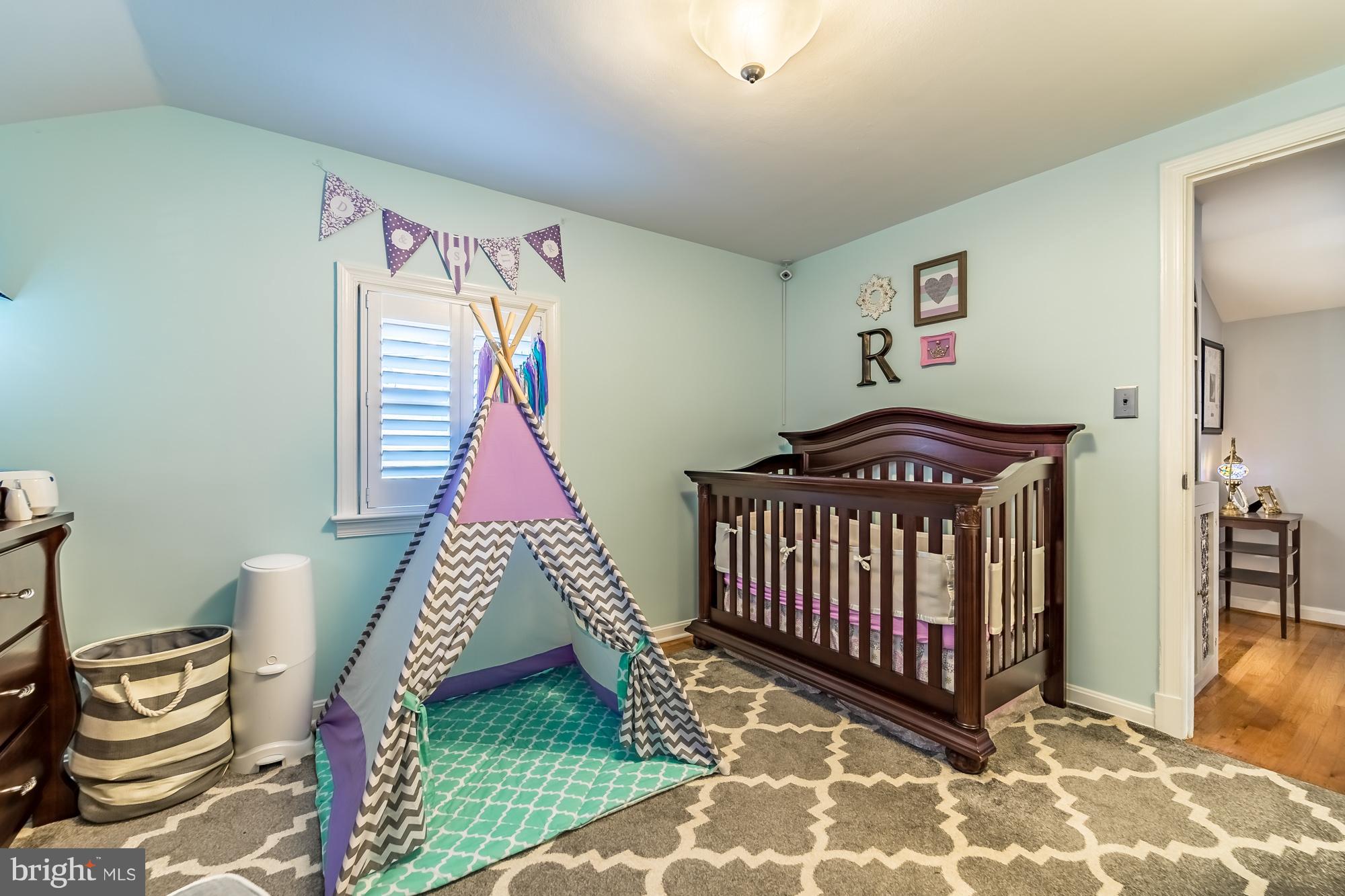 1603 Moffet Road Silver Spring, MD 20903 - Photo 22 of 30 a bedroom with a bed and a window