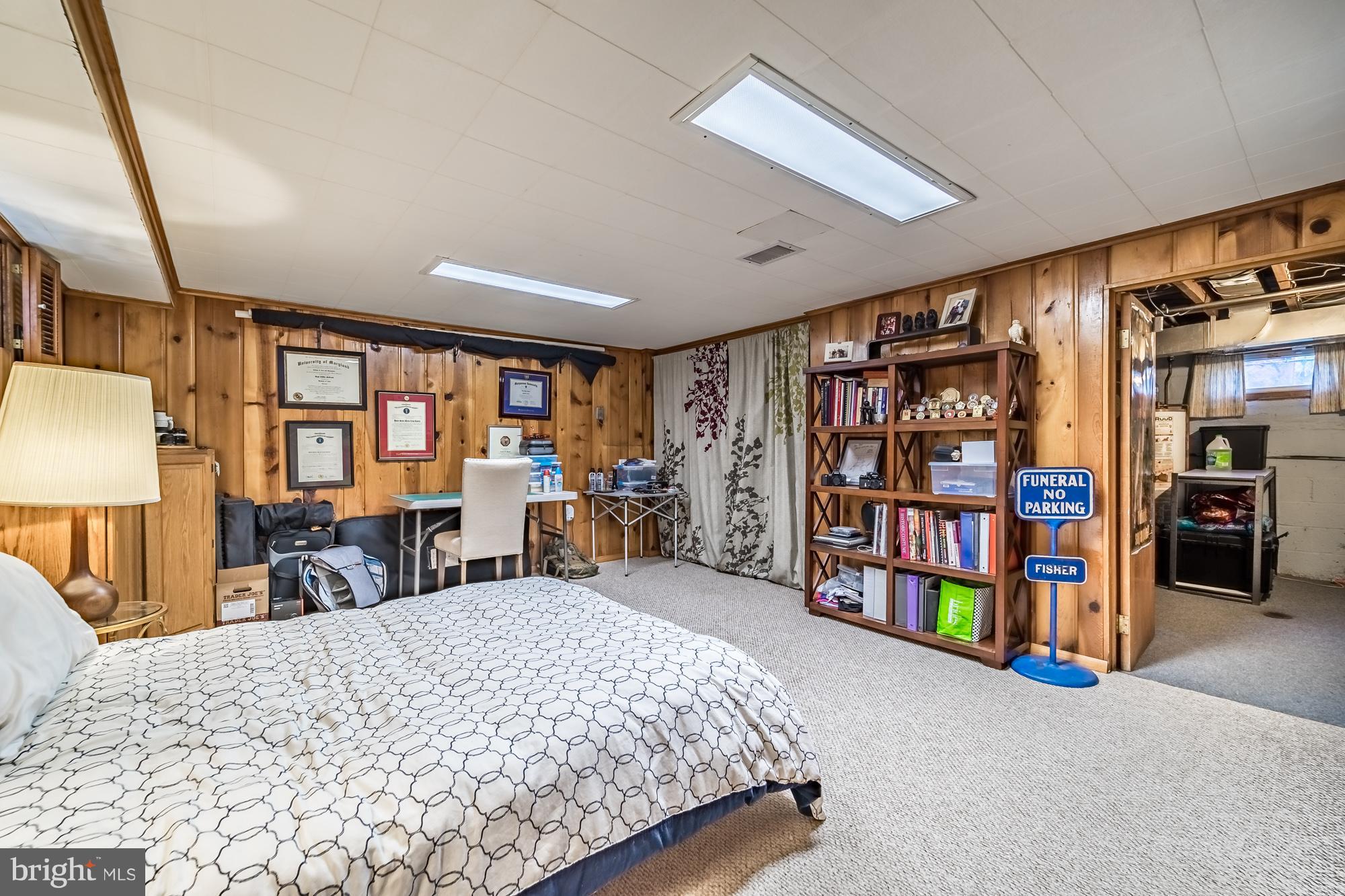 1603 Moffet Road Silver Spring, MD 20903 - Photo 26 of 30 a bed room with a bed and a bookshelf