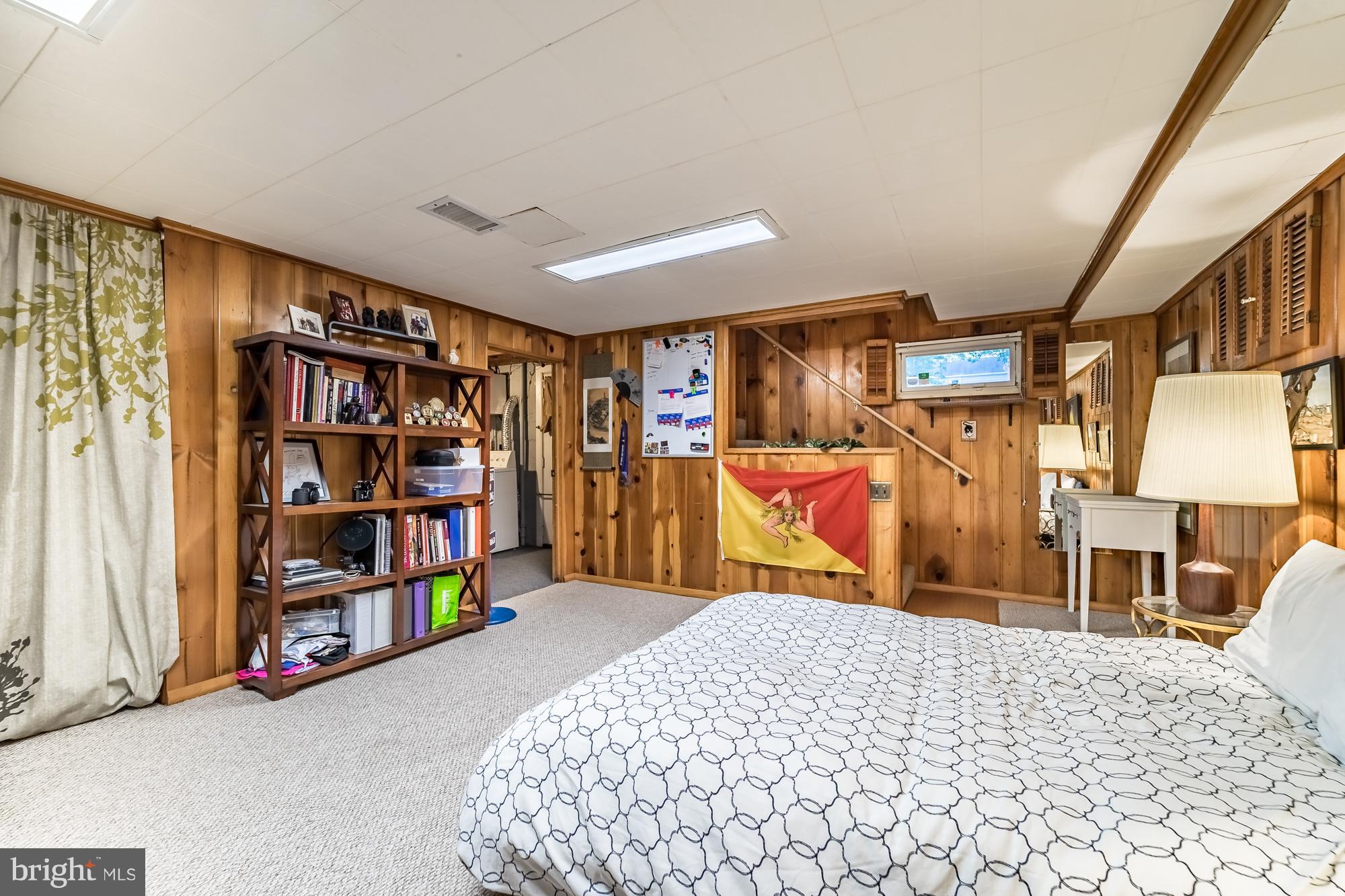 1603 Moffet Road Silver Spring, MD 20903 - Photo 27 of 30 a bedroom with furniture and book shelf