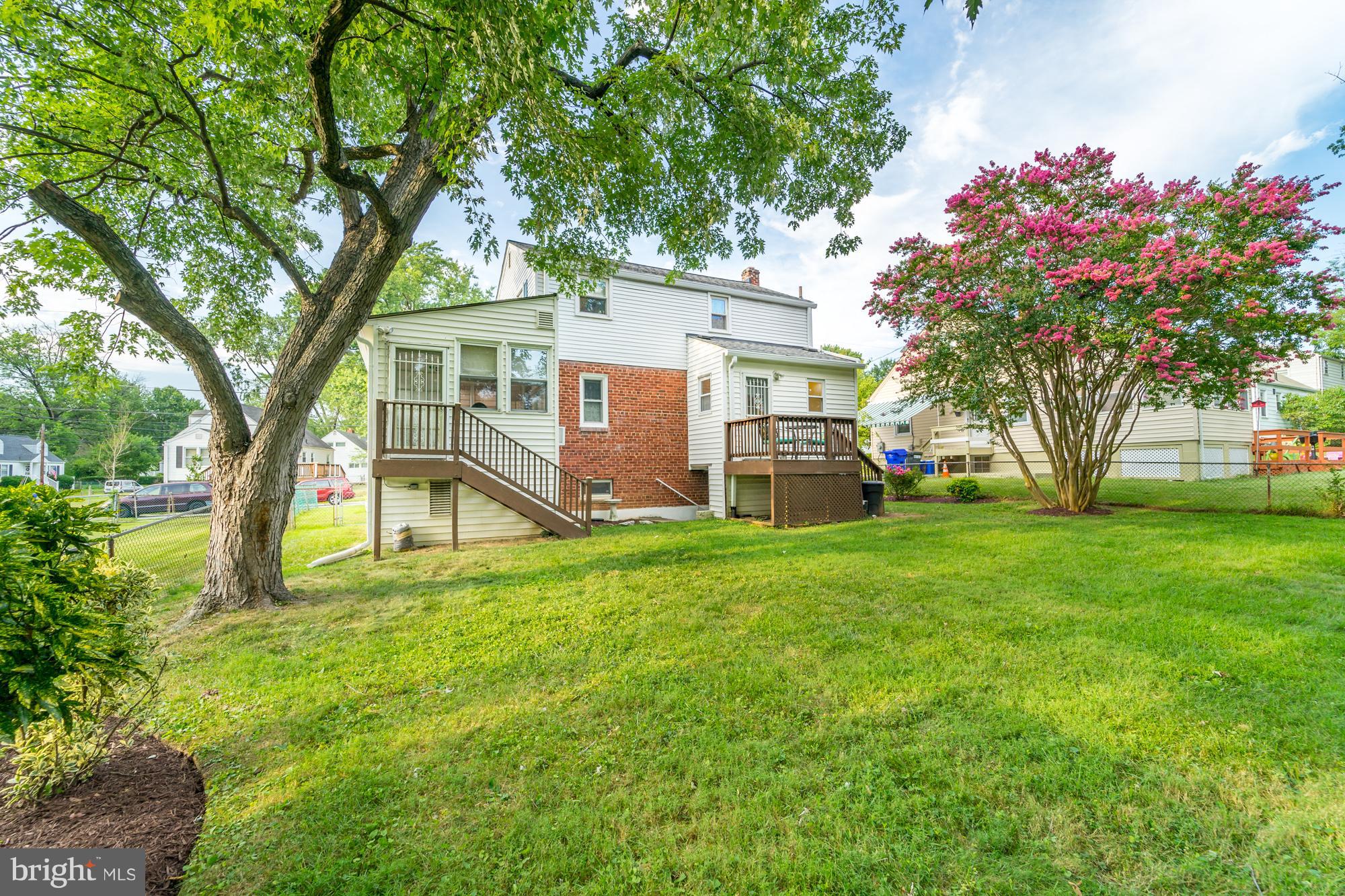 1603 Moffet Road Silver Spring, MD 20903 - Photo 30 of 30 a view of a house with a big yard and large trees
