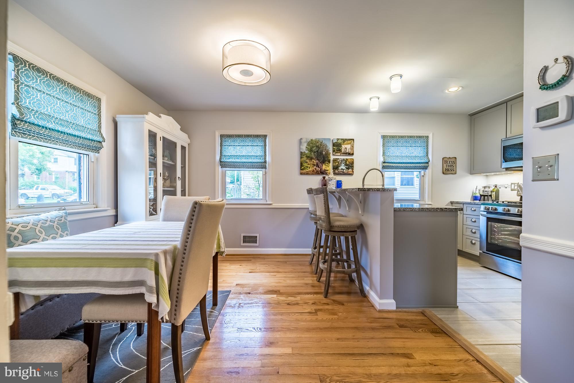 1603 Moffet Road Silver Spring, MD 20903 - Photo 6 of 30 a living room with furniture a dining table and a window