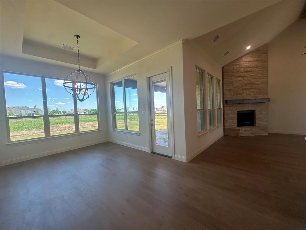 9424 Bluestem Lane DISH, TX 76247 - Photo 12 of 28 a view of a kitchen with a sink dishwasher and a fireplace