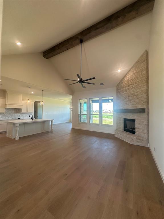 9424 Bluestem Lane DISH, TX 76247 - Photo 16 of 28 an empty room with windows and fireplace