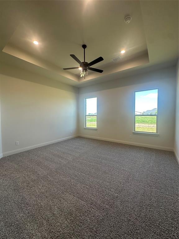 9424 Bluestem Lane DISH, TX 76247 - Photo 19 of 28 an empty room with a window and a ceiling fan