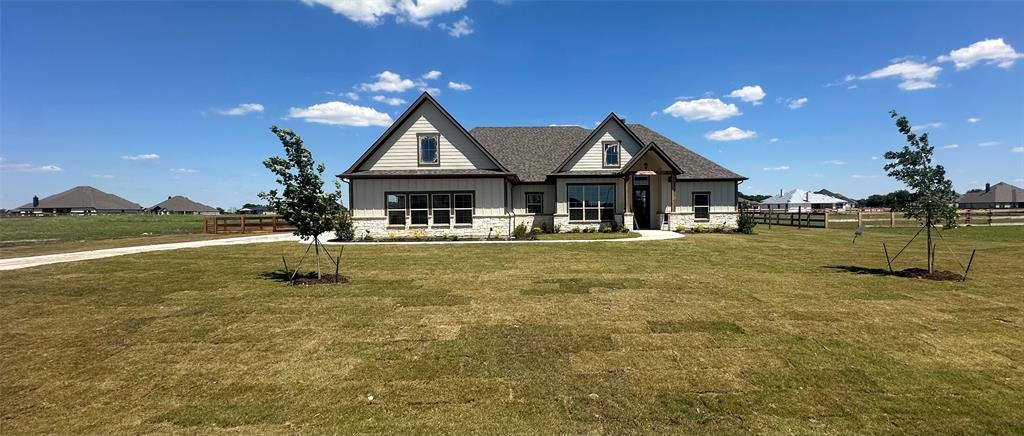9424 Bluestem Lane DISH, TX 76247 - Photo 2 of 28 a front view of a house with a yard